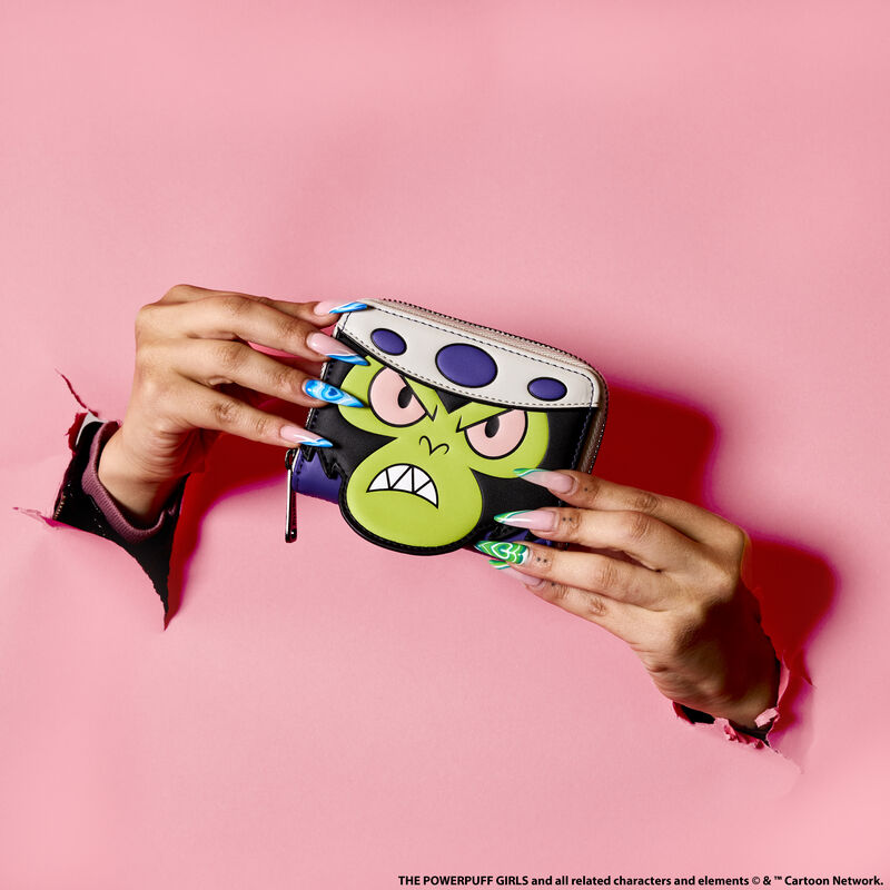 Two hands holding the Mojo Jojo Cosplay Wallet bursting through a pink background